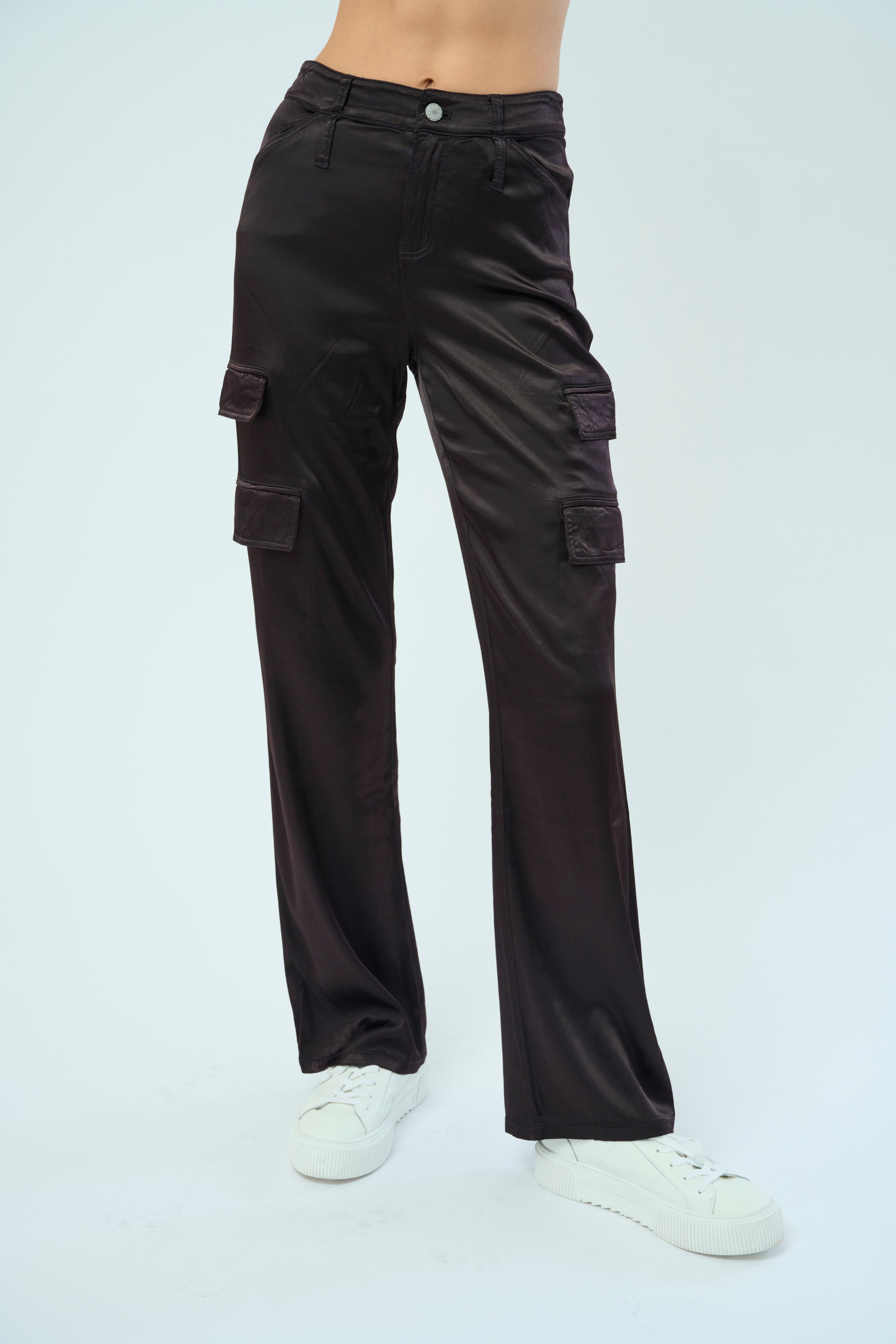 Front view of a tall female model confidently posing wearing our dark chocolate colored Zendaya Stretch Viscose Satin Wide Leg Pant from Marrakech Clothing.