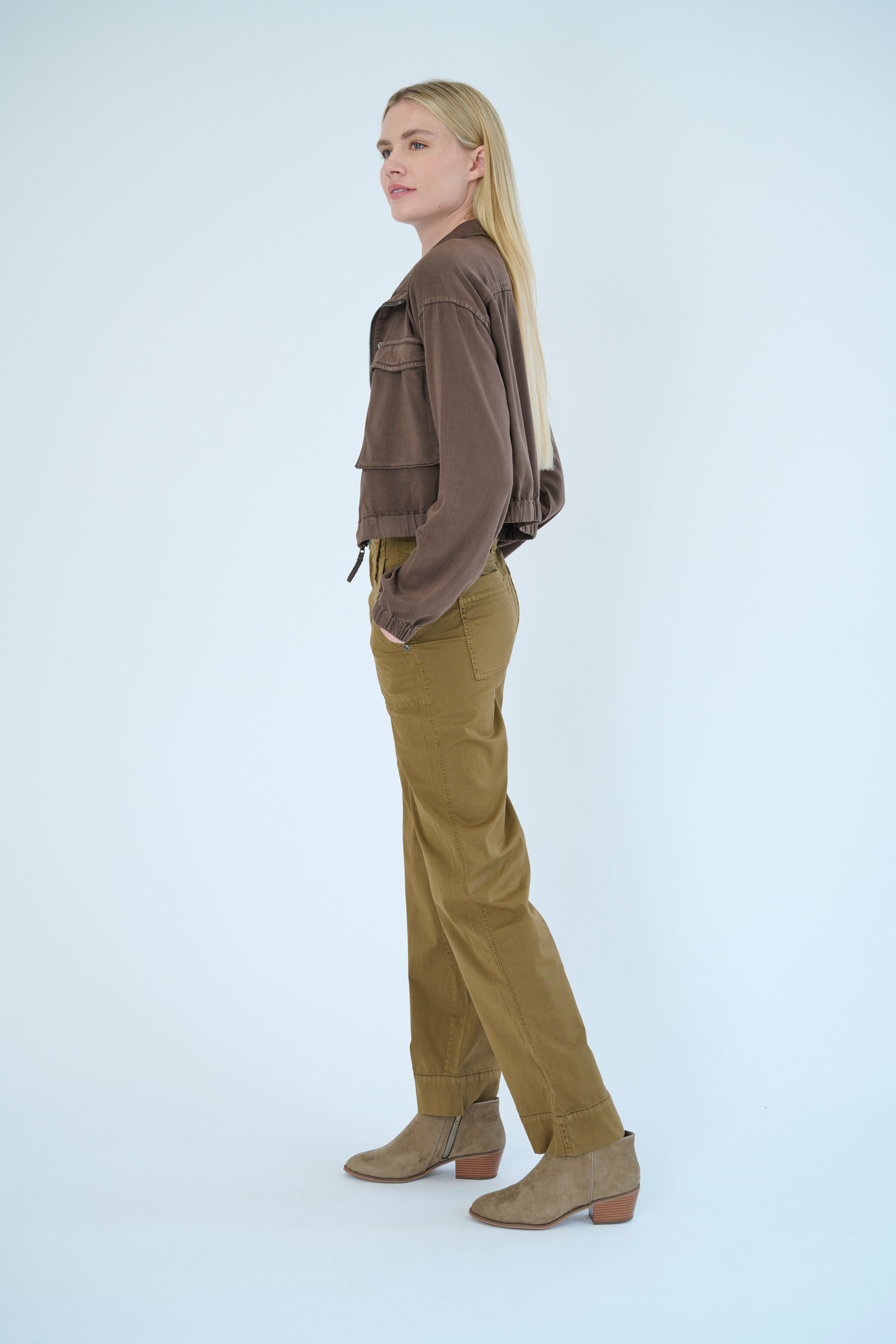 Side view of model wearing the Darilyn pant in Cheetah color and Nelle jacket in Hazel.