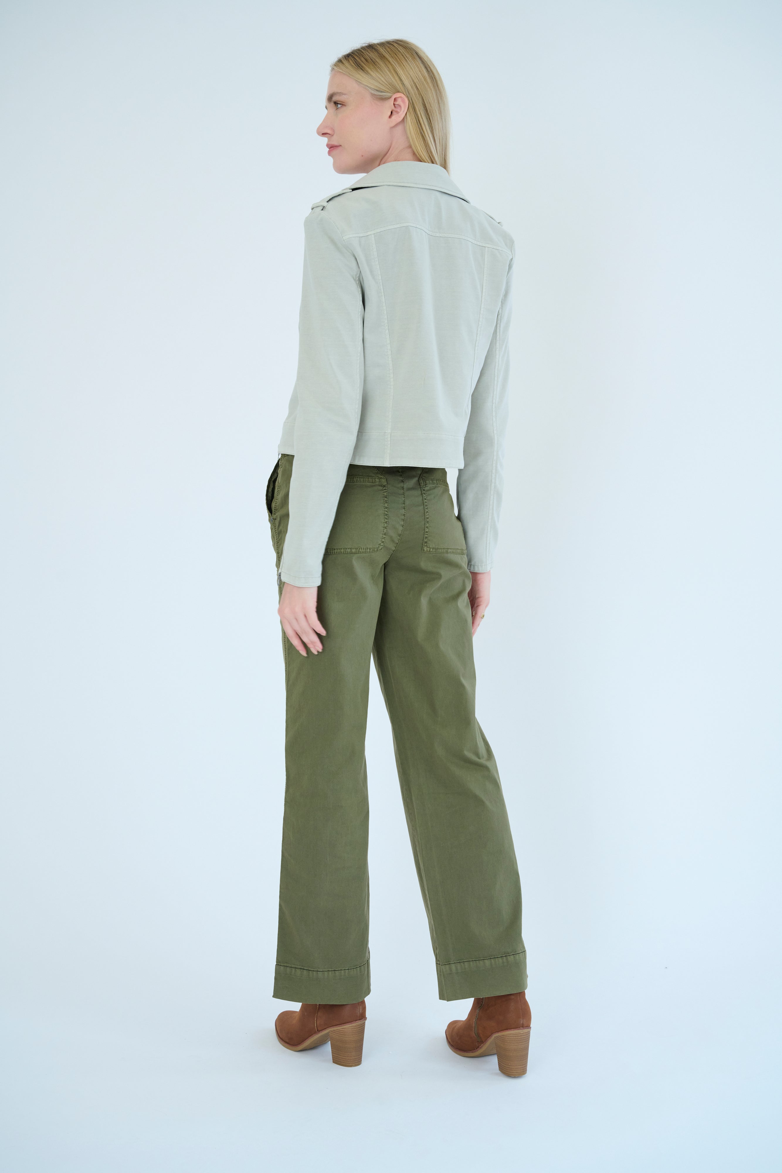 Back view of model wearing Darilyn pant in Pine color and Layla jacket in Cloud color