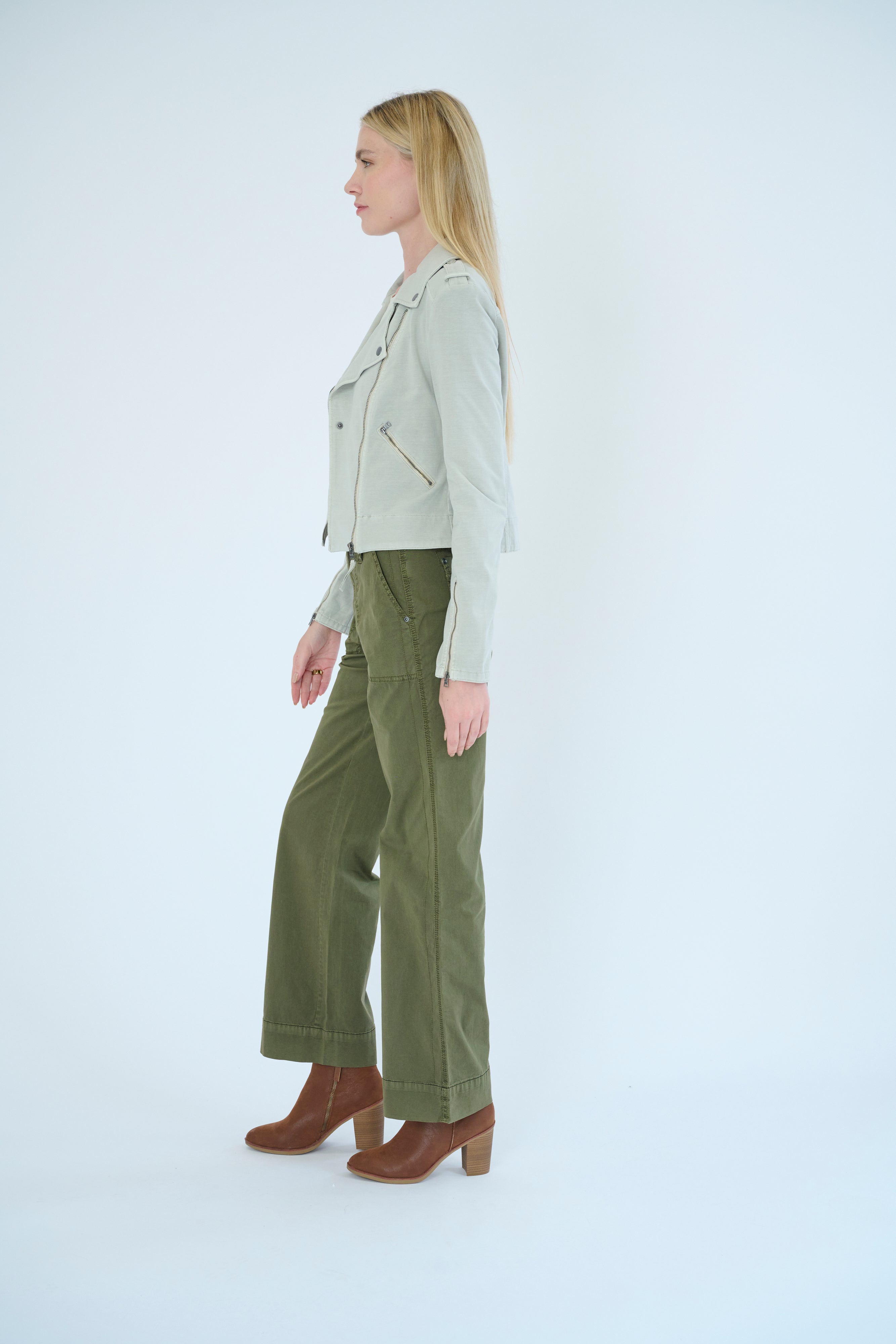 Side view of model wearing Darilyn pant in Pine color and Layla jacket in Cloud color