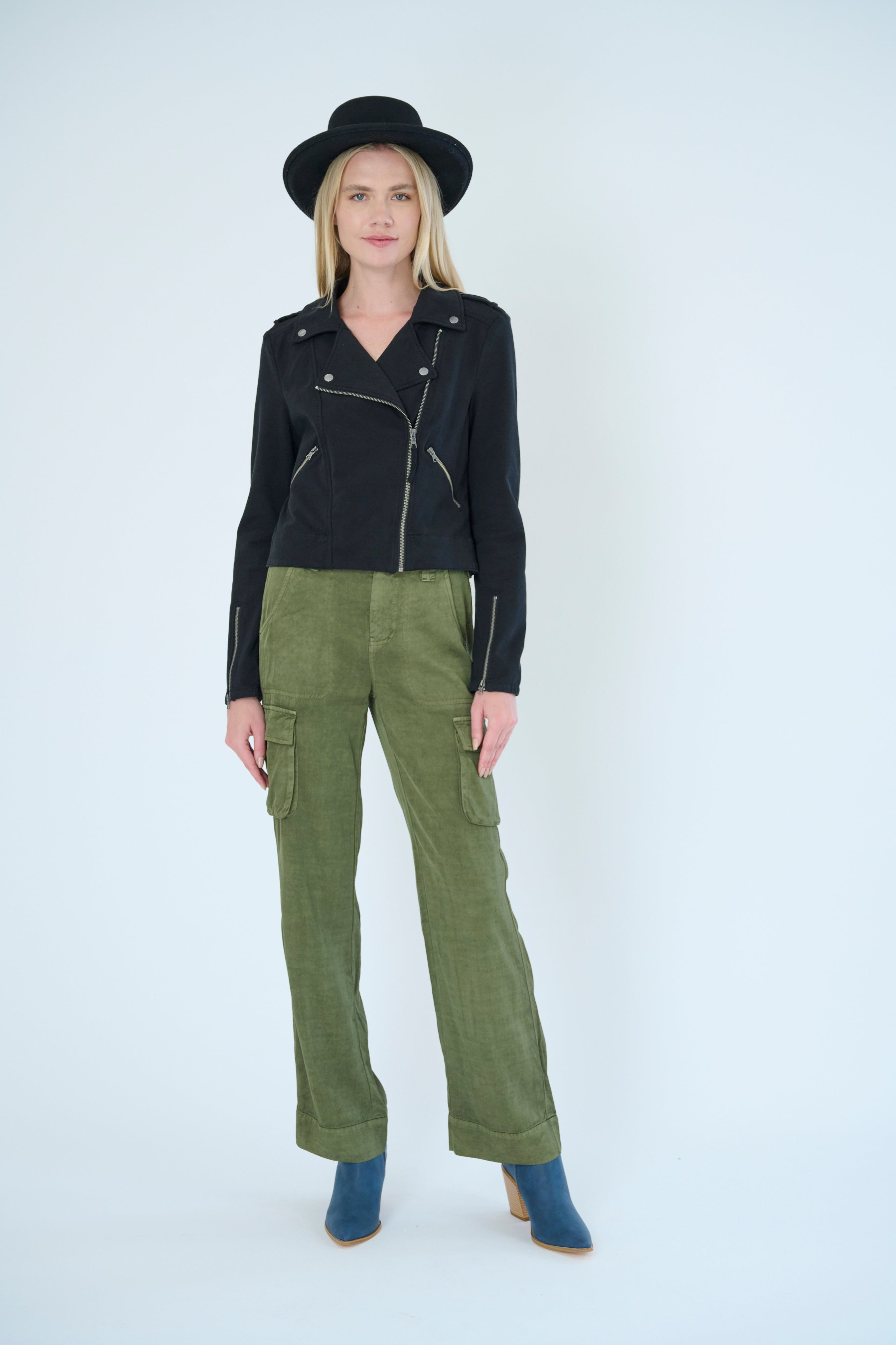 Front view of model wearing Gavyn pant in Pine color and Layla jacket in Black color