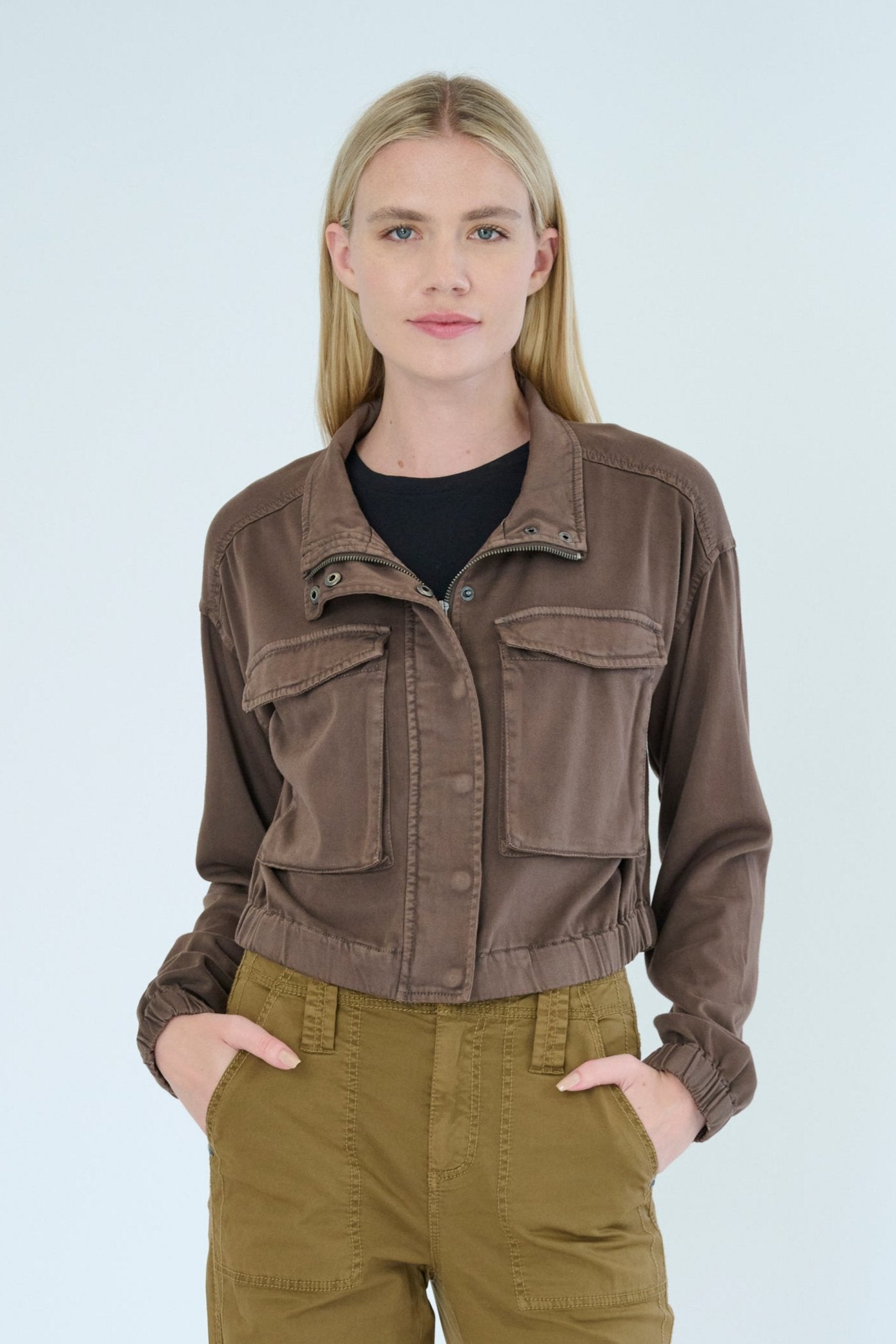 Front view of model wearing Nelle jacket in Hazel color. 