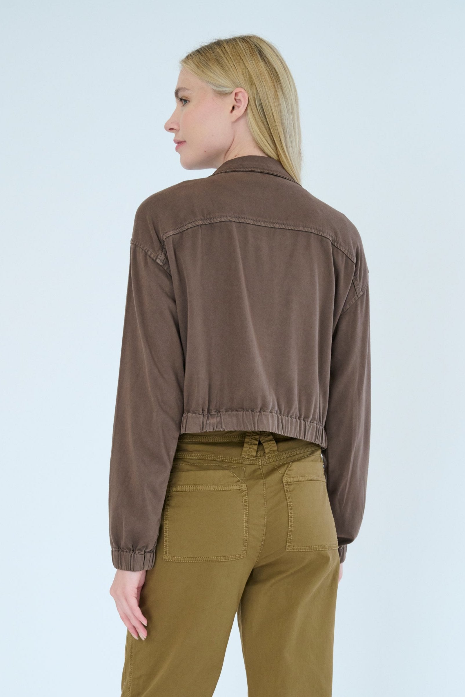 Back view of model wearing Nelle jacket in Hazel color.