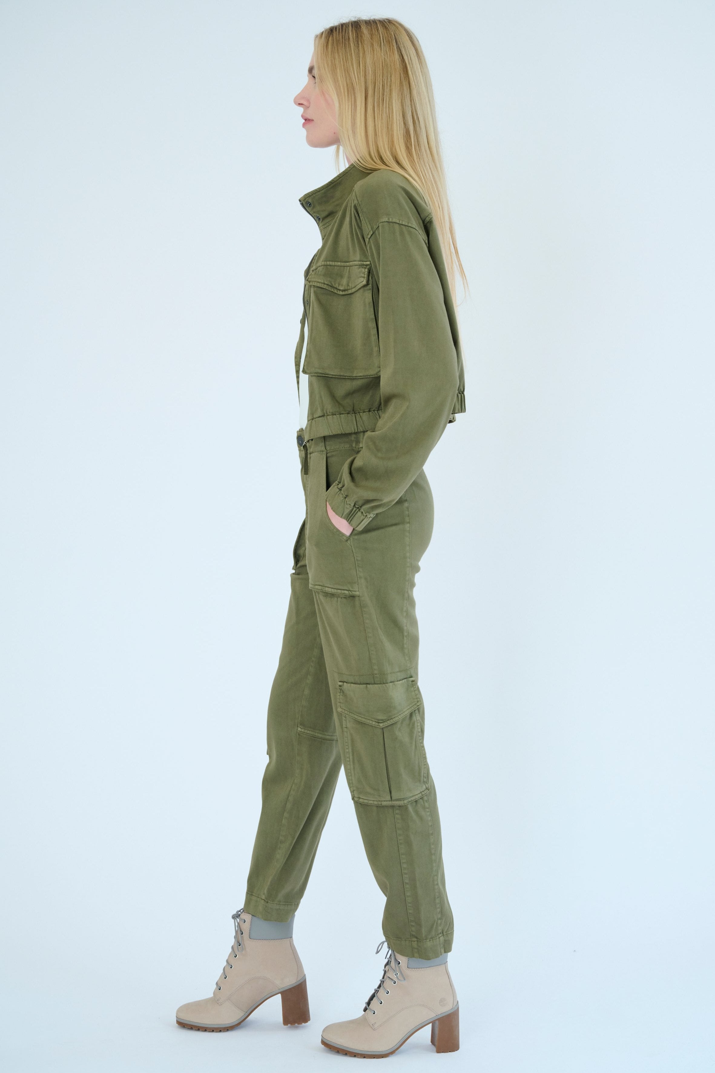 Side view of model wearing Nelle jacket and Raisa pant in Pine color