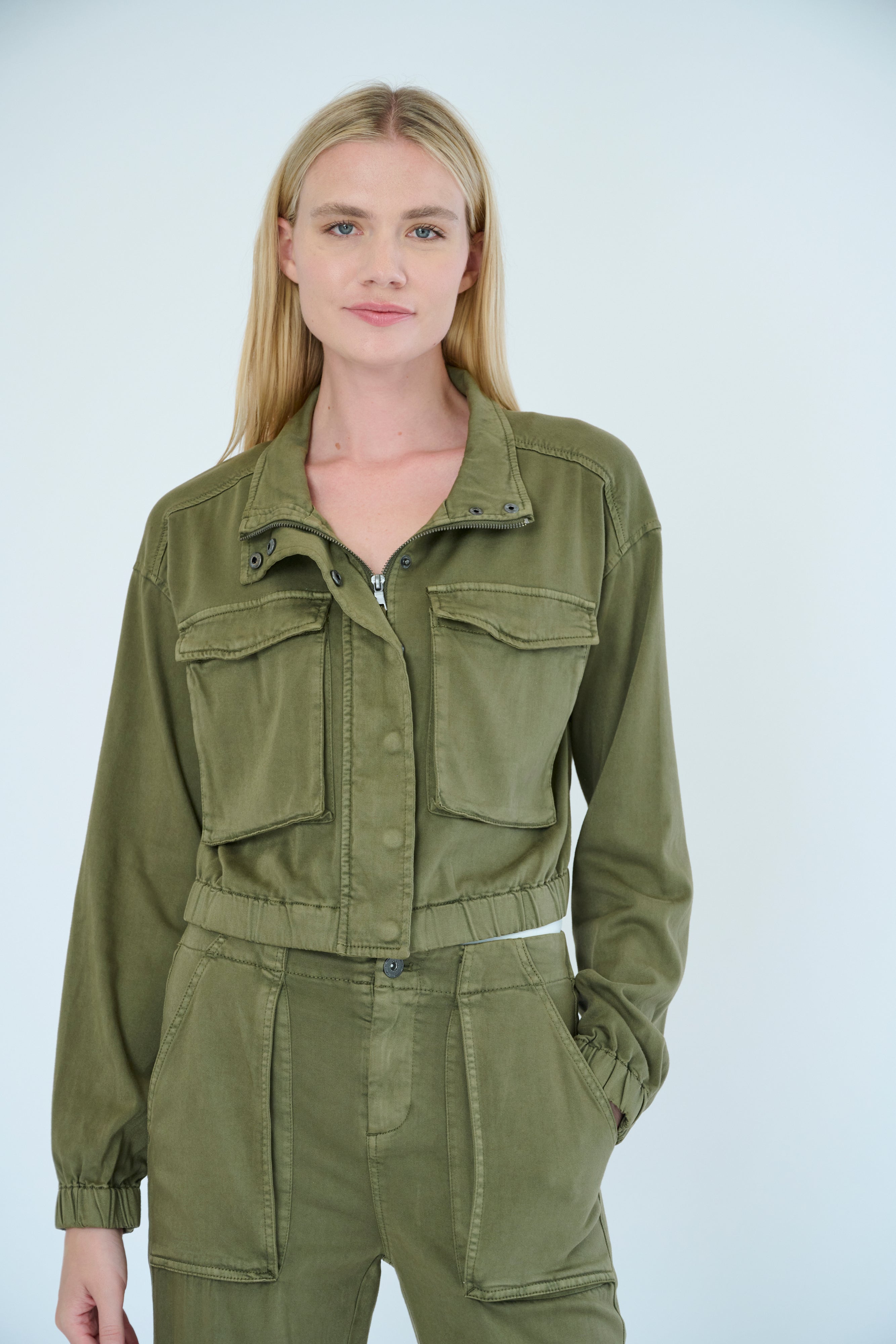 Front view of model wearing Nelle Jacket and Raisa Pant in Pine color.