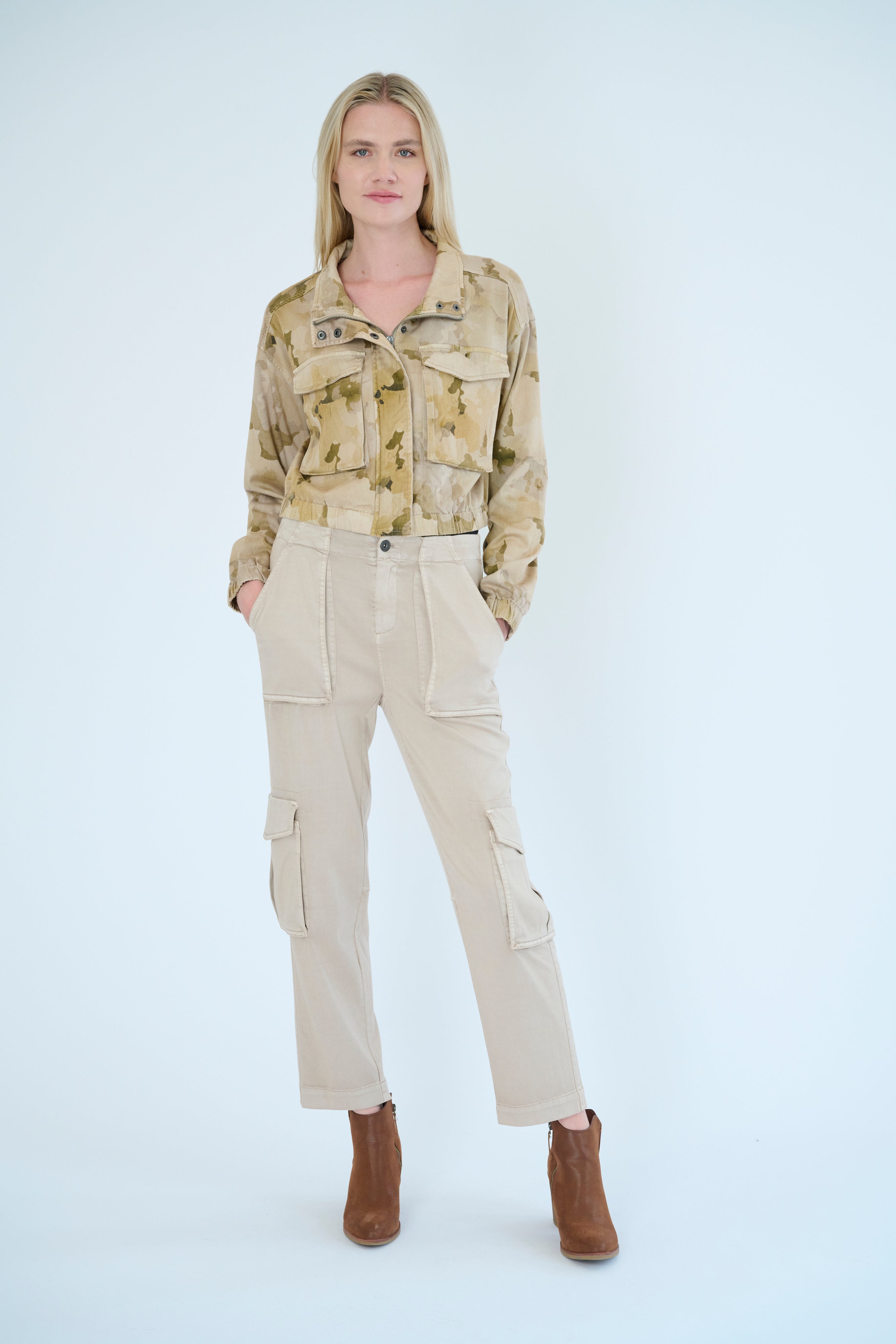 Front view of model wearing Raisa pant in Oat color